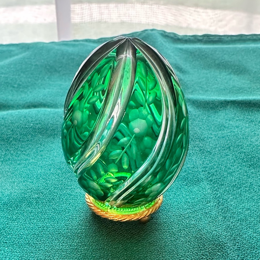 The House of Faberge “Primrose Swirl Emerald Green Cut to Clear Crystal Egg”